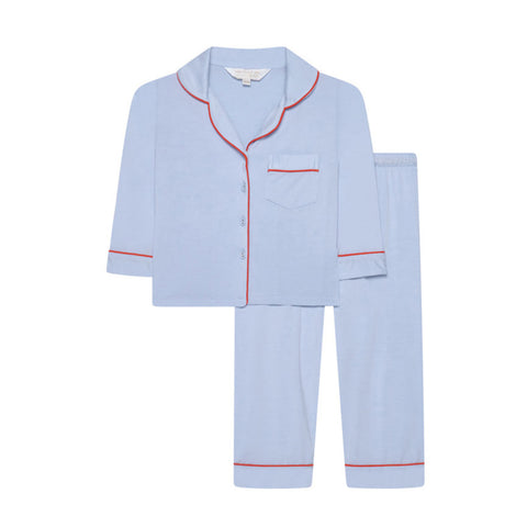 Light blue pajama set with red piping on a white background